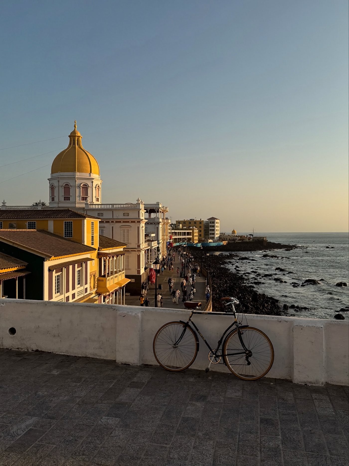 Rooftops, a domed church and the seafront promenade of the French Quarter seen at dawn